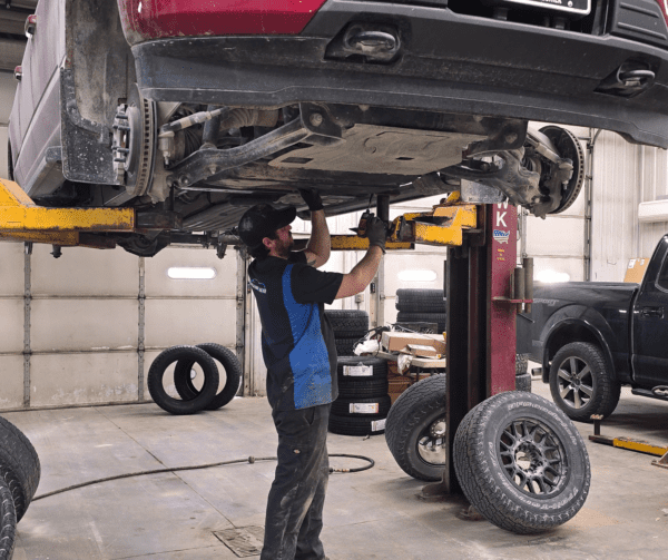 picture of oil getting changed on a ford truck at auto repair shop